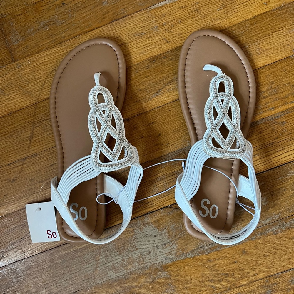 Women’s white sandals, new with tags.